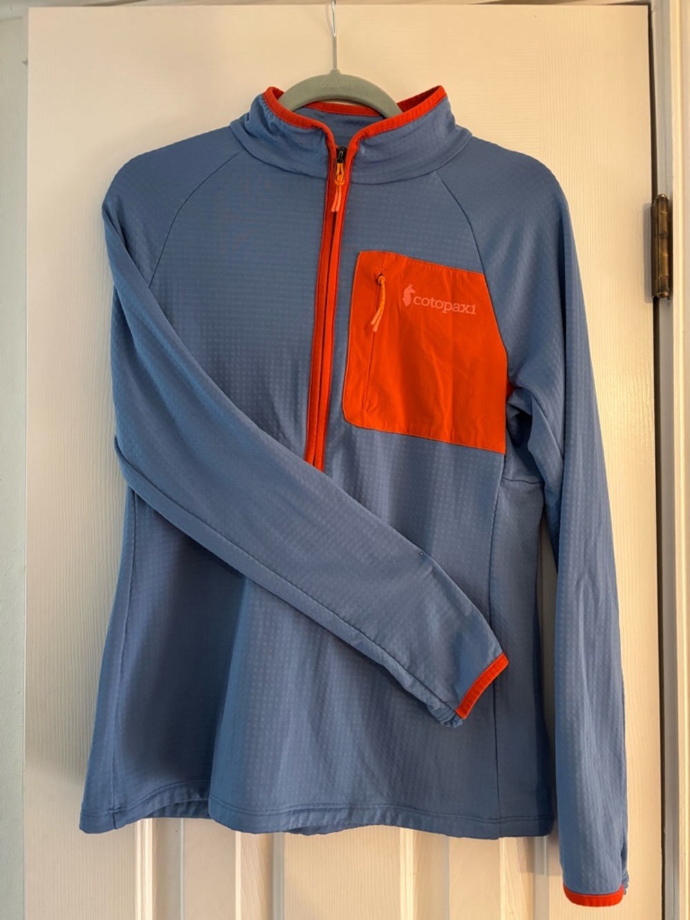 Cotopaxi Oteri fleece half zip.  Blue Pullover with Orange Trim. SIZE: Womens M